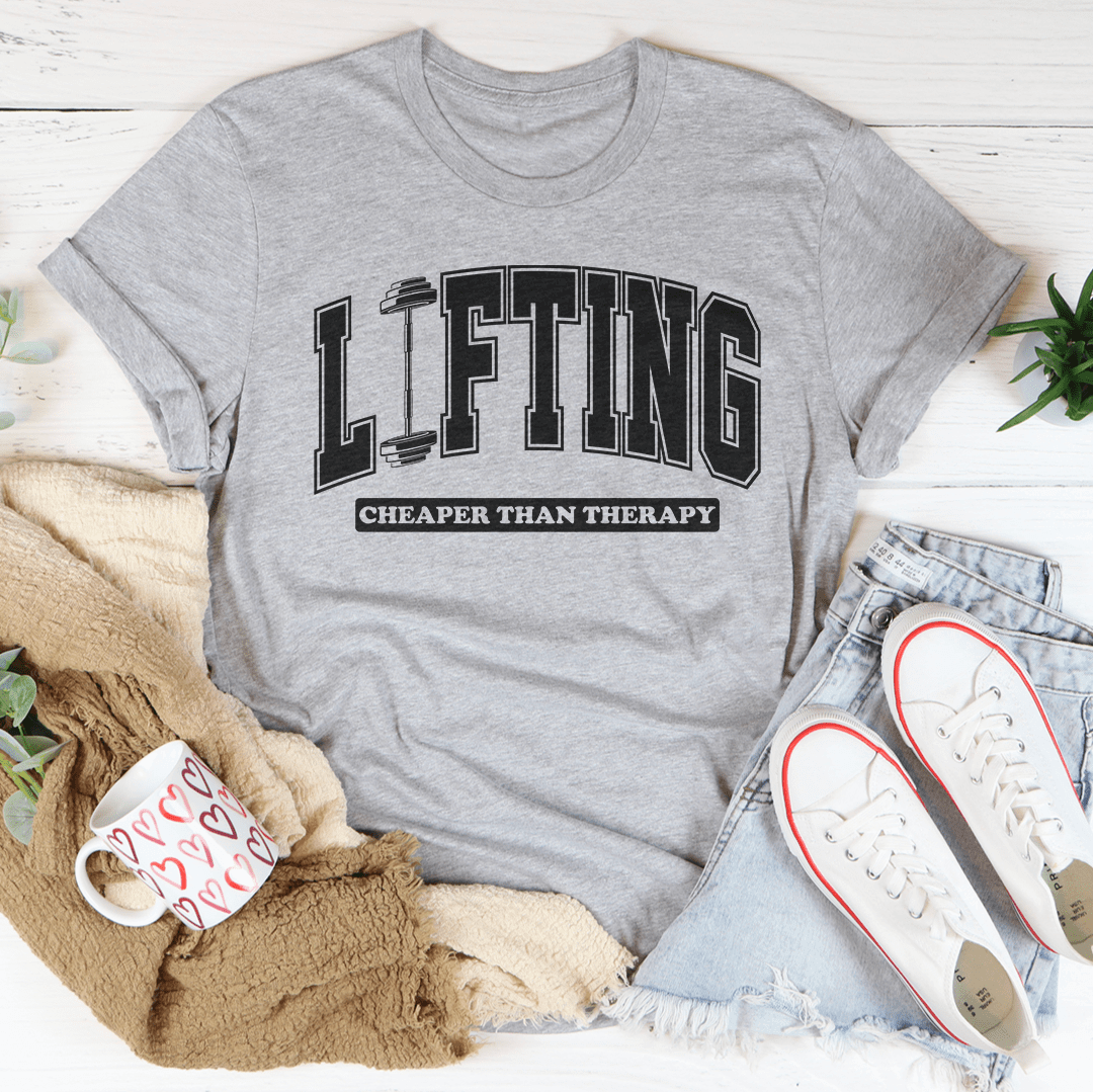 Lifting Cheaper Than Therapy Tee in Athletic Heather color, perfect for casual or workout wear featuring lifting therapy graphic tee.