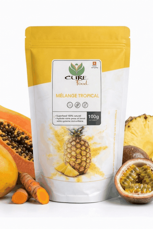 Tropical Mix active lifestyle superfood powder in a package surrounded by fresh fruits and turmeric.