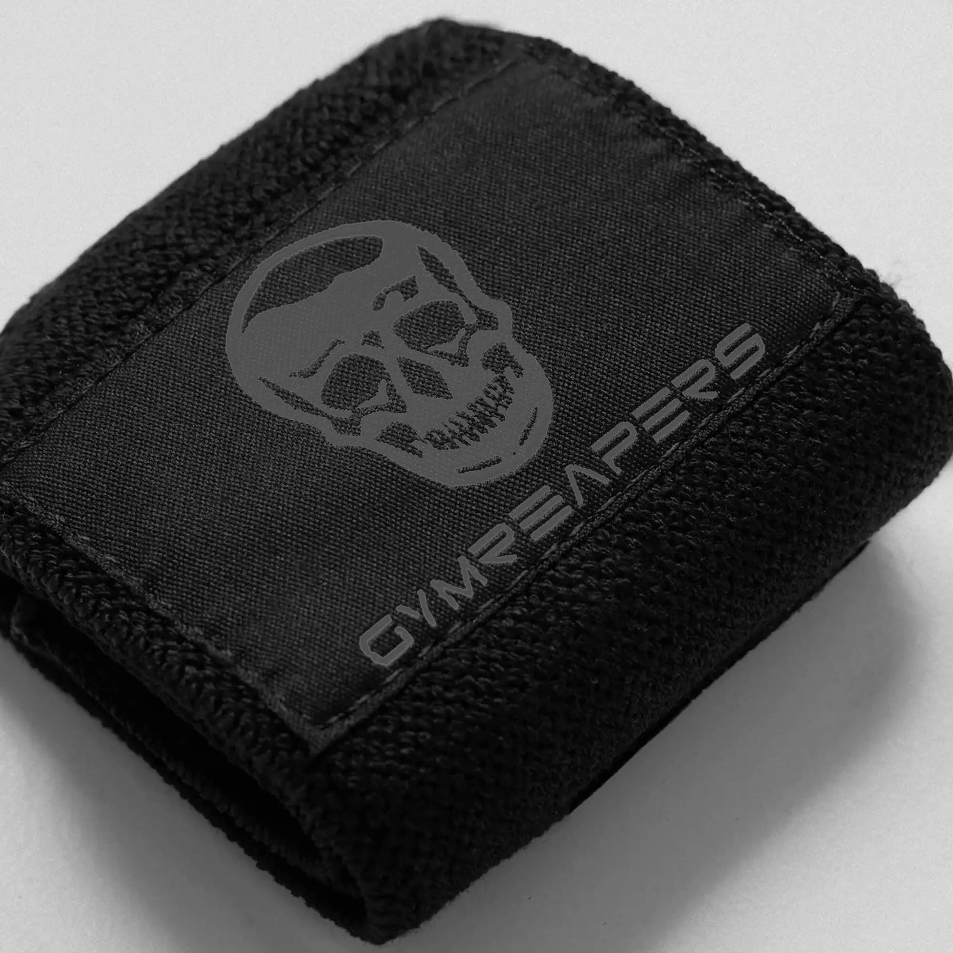 Black gym wrist wraps by My Store 2, showing adjustable straps and reinforced stitching for wrist support during workouts.