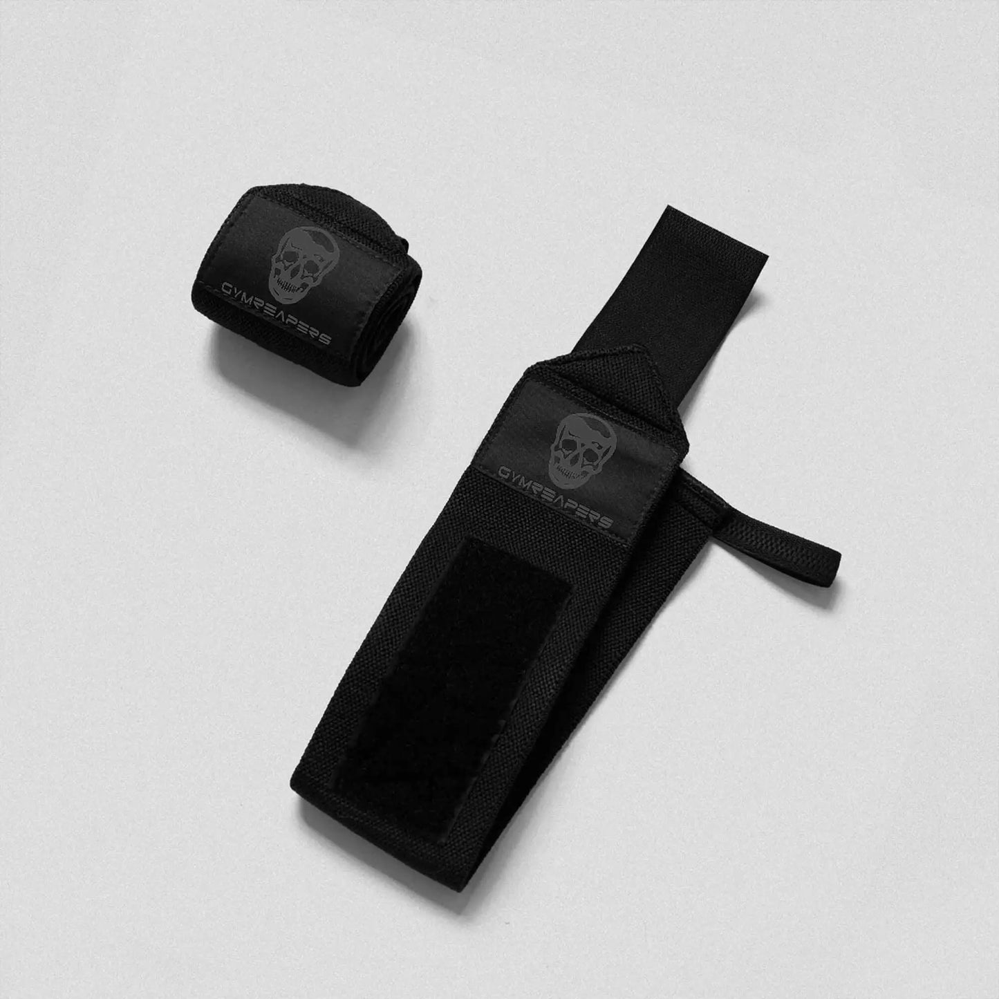 Black gym wrist wraps by My Store 2, showing adjustable straps and reinforced stitching for support during weightlifting.