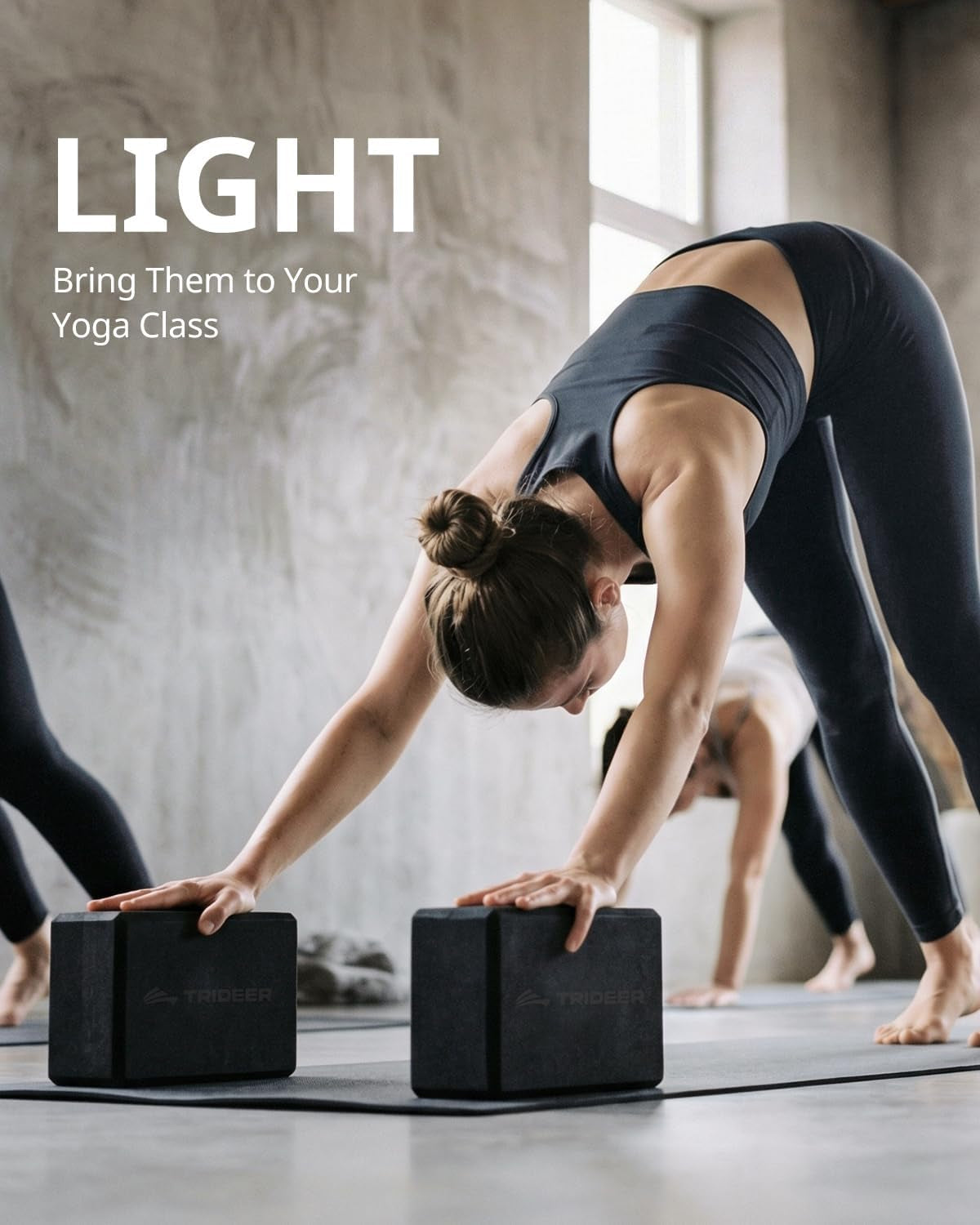 Pair of black My Store 2 yoga blocks made of soft non-slip foam with beveled edges for yoga, Pilates, and dance stretching.