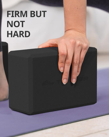 Two black My Store 2 yoga foam blocks with beveled edges, non-slip surface, and lightweight design for yoga and Pilates practice.
