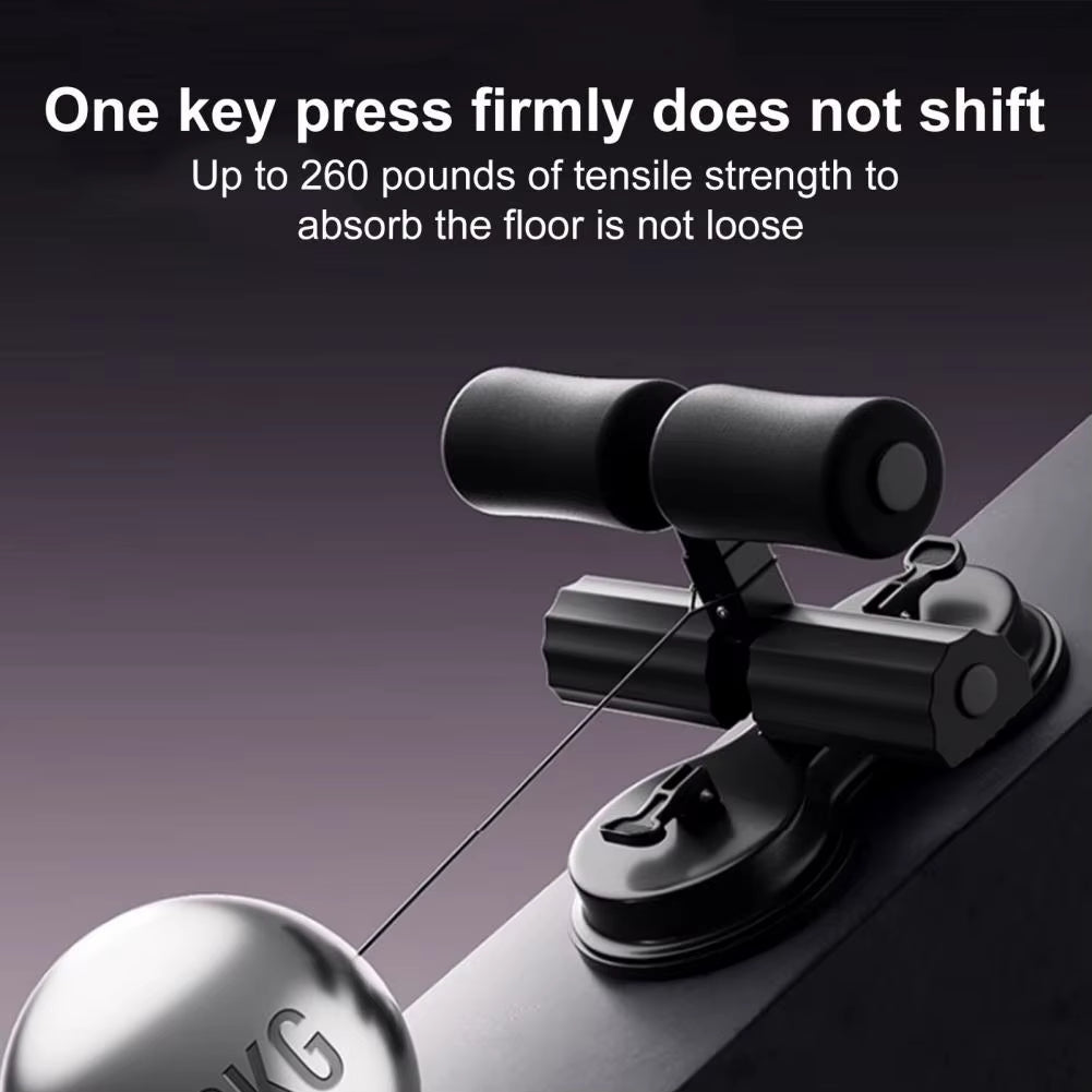 Grey CoreMax™ Sit-Up Assistant Bar with resistance band and dual suction cups for home gym core workouts.