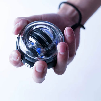 My Store 2 GyroForce™ LED Power Wrist Ball with multi-color lights showing in use for strength training and muscle grip exercise.