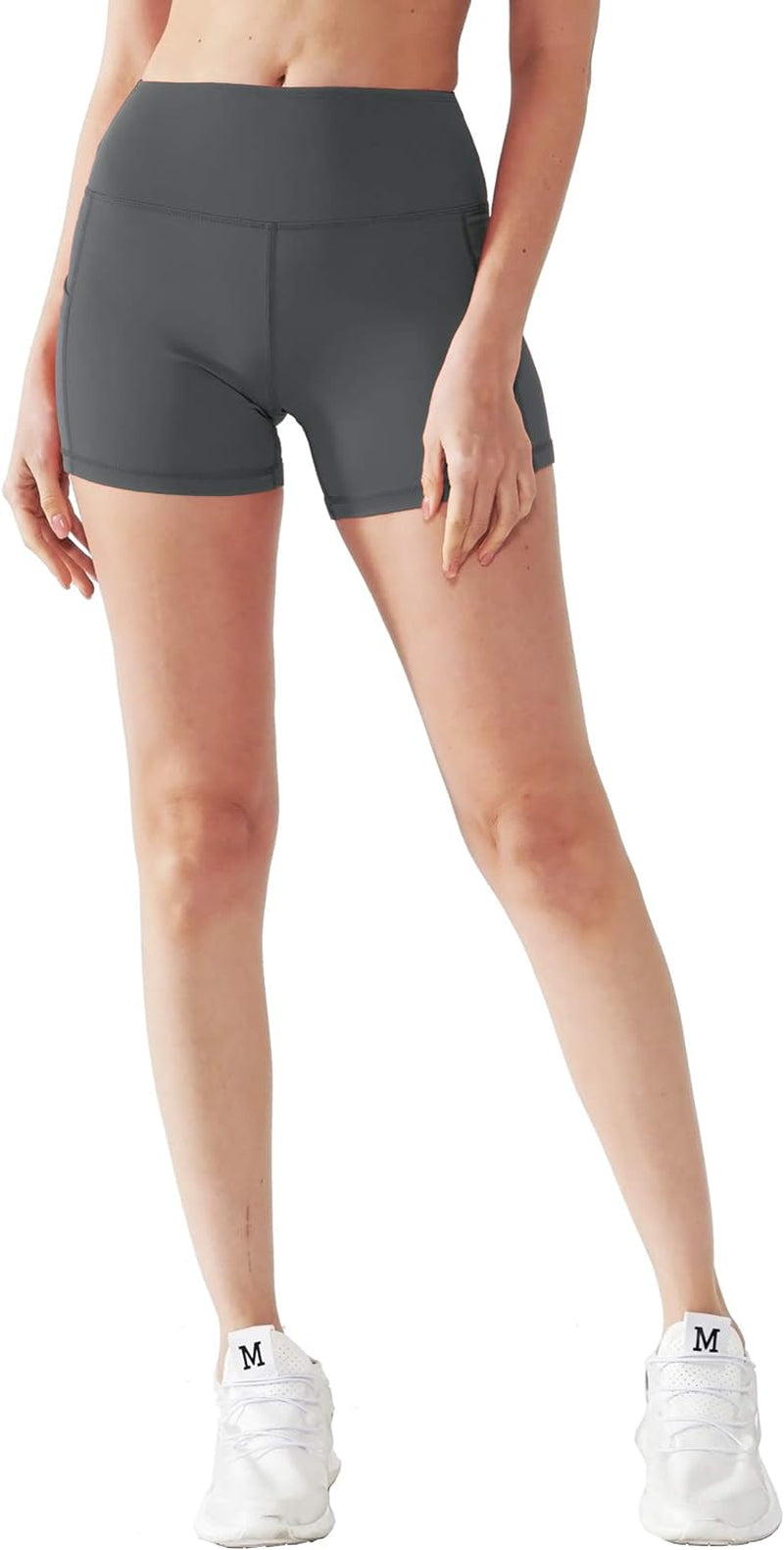 Set of three women's high waist athletic shorts in grey, black, and purple with deep pockets, ideal for yoga, fitness, and running.