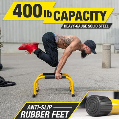 Yellow parallette push-up bars and dip station stand for home gym, ideal for gymnastics, calisthenics, and strength training exercises.
