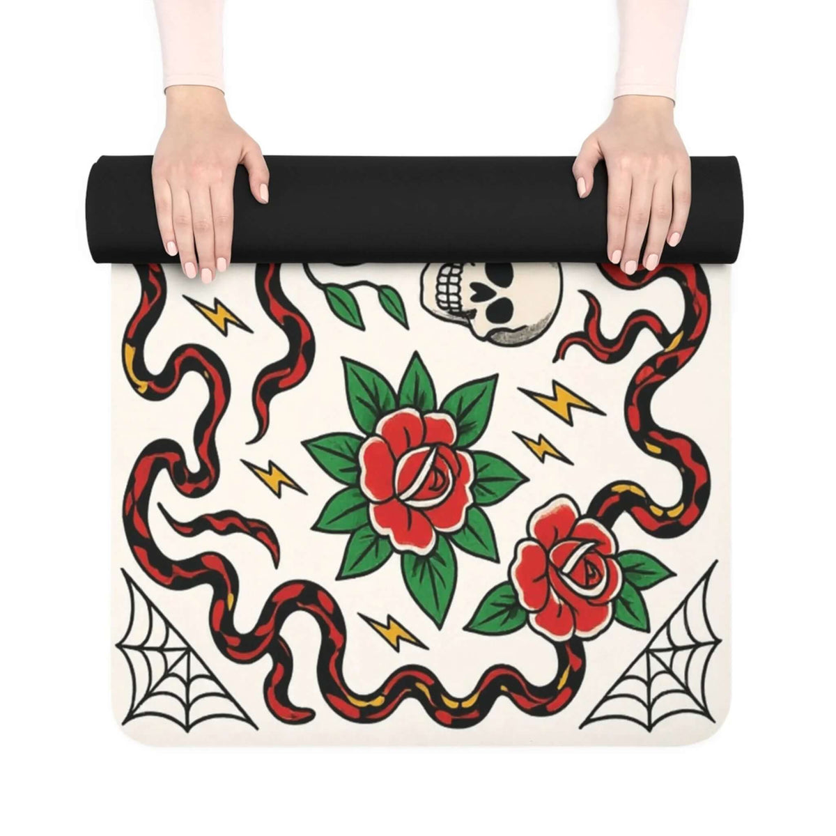 Black cat yoga mat design with skull, roses, snakes, and lightning, rolled up for storage and workouts.