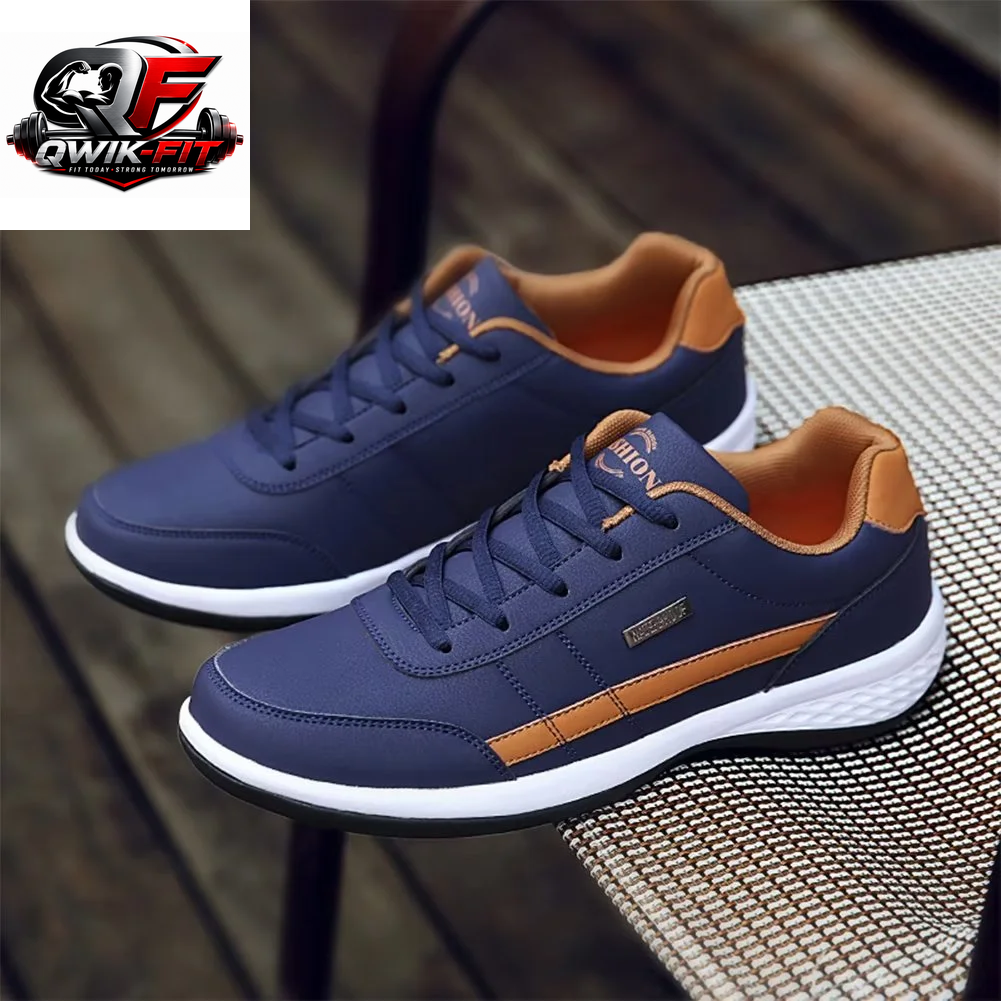 breathable casual leather running sneakers in navy and orange color on a woven surface